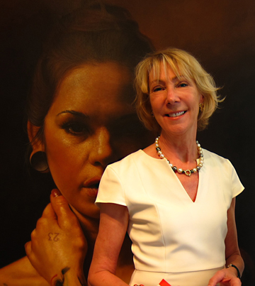 Laney Lewis, The Fine Arts Conservancy, restorers of fine art/antiques. Painting in background by artist Darian Rodriquez Mederos: La Venus Moderne. <brPhoto by Irene Sperber.