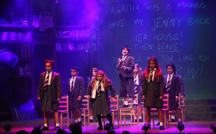 Bruce (Elijah Leano) gets his time in the limelight, surrounded by his classmates, at the end of the show. <br>Photo: John Rodaz.