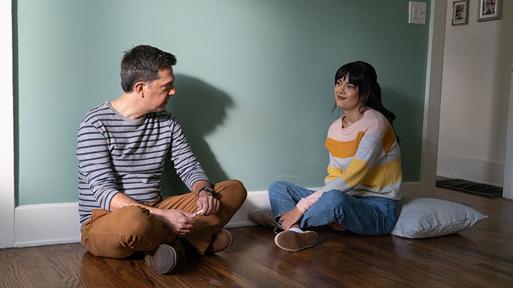 Ed Helms and Patti Harrison in a scene from