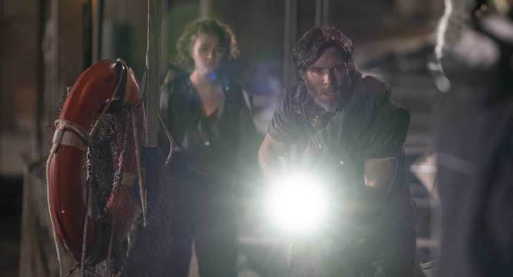 Millicent Simmonds as Regan Abbott and Cillian Murphy as Emmett in a scene from