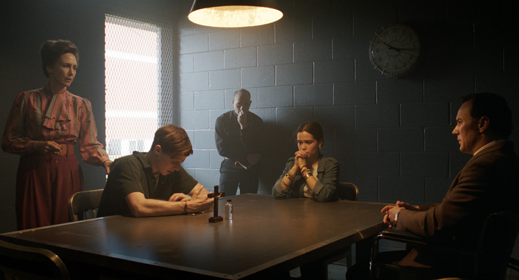Vera Farmiga as Lorraine Warren, Ruairi
O'Connor as Arne Johnson, Vince Pisano as Father Newman, Sarah
Catherine Hook as Debbie Glatzel and Patrick Wilson as Ed
Warren in a scene from