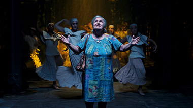 Olga Merediz (center) as Abuela Claudia in a scene from