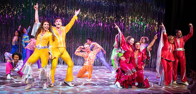 From left to right (front row): Jodie Langel (Donna) and Sean McDermott (Sam) (in yellow costumes), Aaron Bower (Tanya) and Doug Chitel (Harrry) (in red costumes), Britt Steele (Rosie) and Robert Koutras (Bill) (in red costumes) and the cast of “Mamma Mia” at the Wick Theatre. (Photo By Amy Pasquantonio)