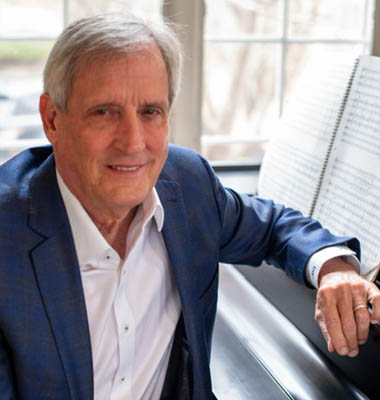 South Florida Symphony Orchestra in residence composer John D. Gottsch at piano working on his world premiere of
