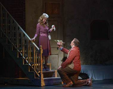 Mitch (Nicholas Huff) presents flowers to Blanche Dubois (Elizabeth Caballero) in Andre Previn's opera of Tennessee Williams' play 