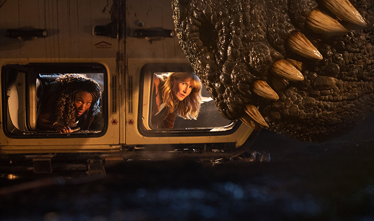 DeWanda Wise, Laura Dern and a Giganotosaurusin a scene from