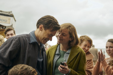 Harry Styles and Emma Corrin in a scene from 