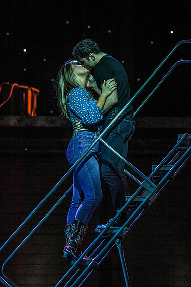 Ren McCormack (Kyle Southern) and Ariel Moore (Caiti Marlowe) embrace in a scene from Slow Burn Theatre Company's production of