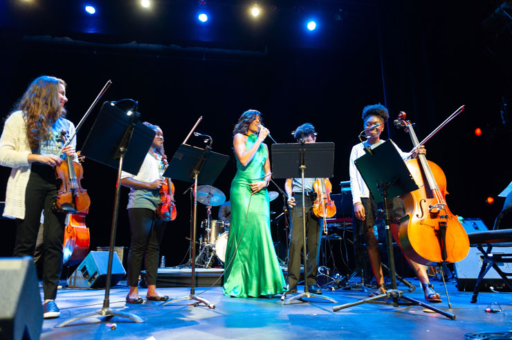 Nicole Henry sings with students from the Miami Music Project. Since the annual concerts started, the Miami Music Project has been the beneficiary of some of the proceeds from the concert.