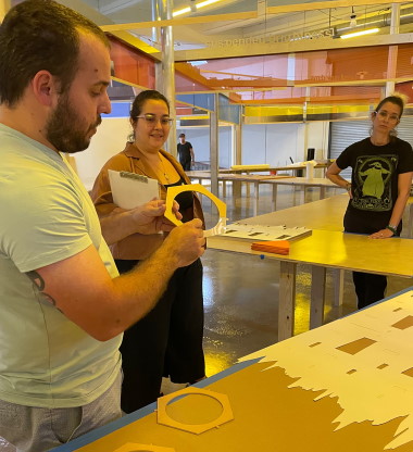 Artist Rafael Domenech explains how to assemble lamps while Locust Project's Laurie Rojas, Program and Grants Consultant, looks on. (Photo by Irene Sperber)