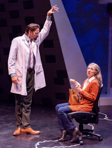 Diana's doctor (Robert Koutras) makes a point to his patient (Jeni Hacker). (Photo by Justin Namon)