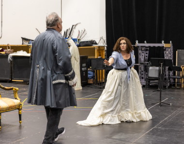 Tosca (Toni Marie Palmertree) warns Scarpia (Todd Thomas) to stay away from her in rehearsal for Florida Grand Opera's