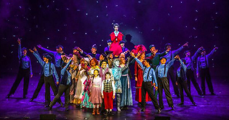 Lighting highlights the titular character in this striking stage picture (Photo by Larry Marano)
