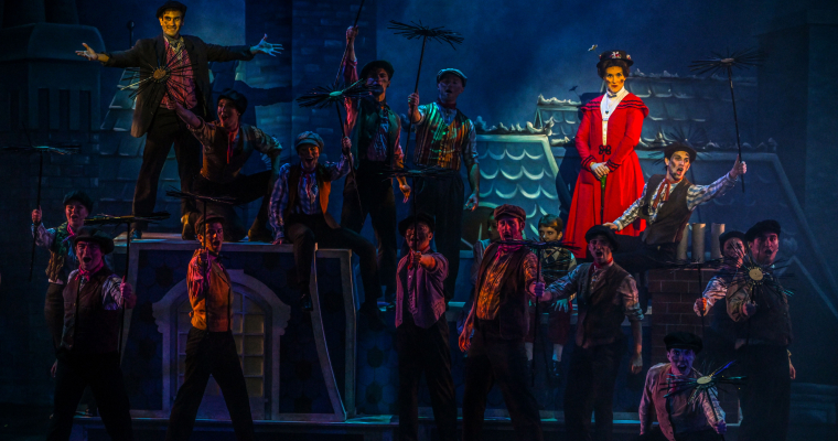 Lighting highlights the titular character in this scene from featuring chimney sweeps from Slow Burn Theatre Company's production of 