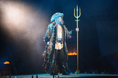 King Triton (Frank Montoto) commands the stage.
