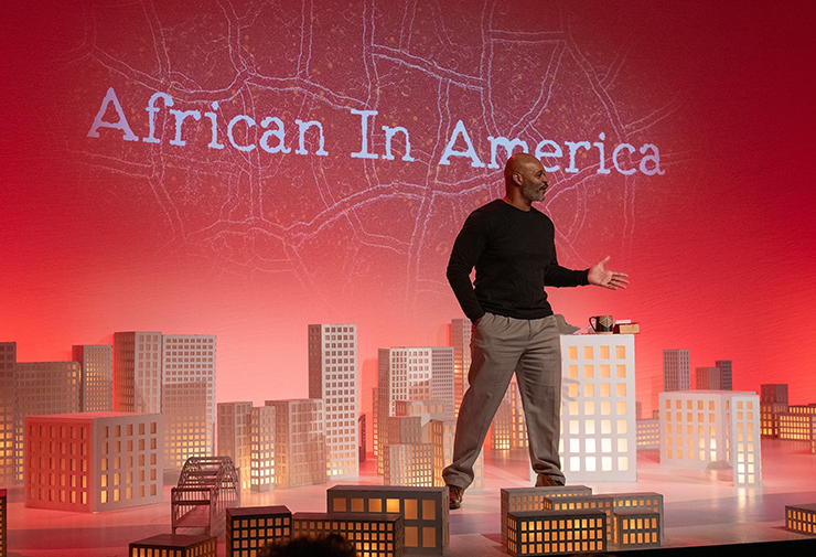 Projection design by Joel Zishuk provides the audience with further, more realistic visual references to the places August Wilson names. (Photo by Magnus Stark)