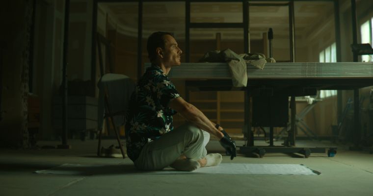 Michael Fassbender plays an assassin with many aliases in a scene from