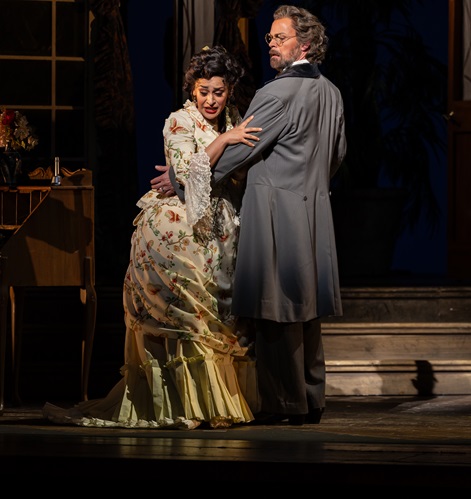 Cecilia Violetta López as Violetta and Troy Cook as Georgio Germont in Florida Grand Opera's 2023-24 production of Giuseppe Verdi's “La Traviata.”