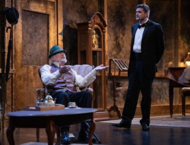 Professor Mashkan (seated) speaks to Stephen Hoffman (Teddy Warren) after he returns from a night at the opera. (Photo courtesy of Magnus Stark)