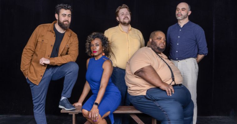 The cast of Florida Grand Opera's “I Pagliacci,” seated Kearstin Piper Brown (Nedda) and Limmie Pulliam (Canio). In back from left, Eleomar Cuello (Silvio), Joseph McBrayer (Beppe), and Robert Mellon (Tonio). (Photo by Eric Joannes)