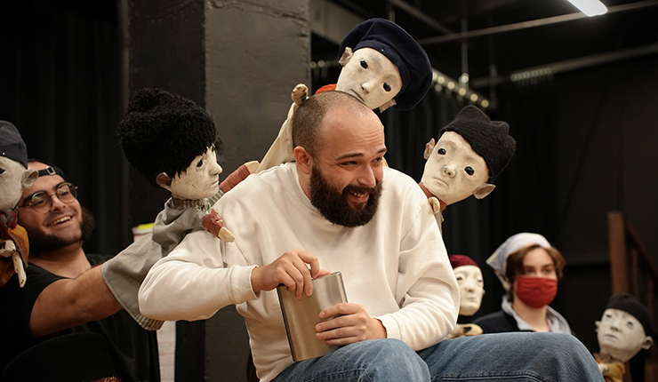 John Mazuelos is surrounded by puppets from New York City-based Phantom Limb Company.