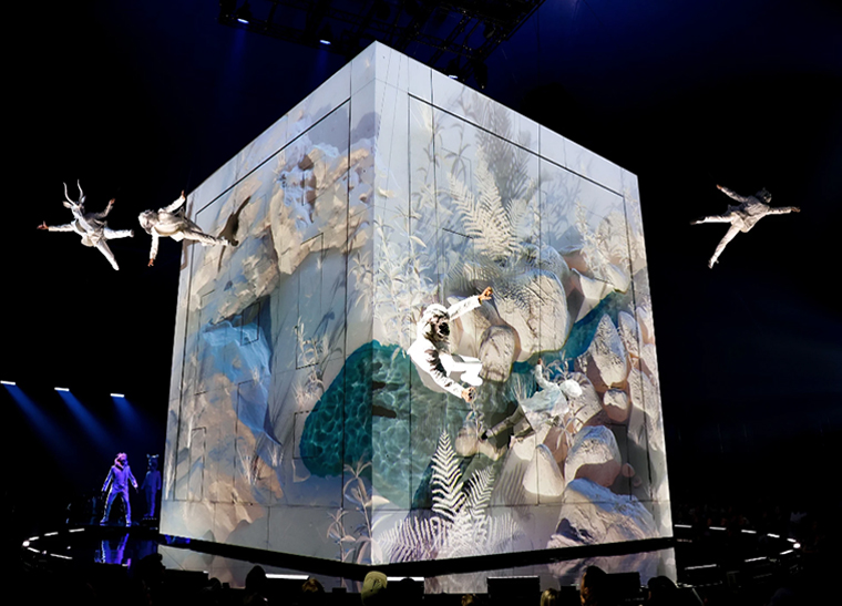 The CUBE, the centerpiece of the show, is the size of a two-story apartment building