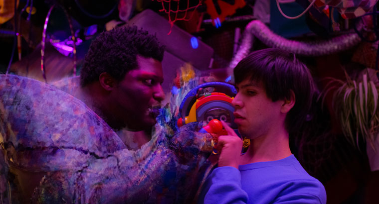 Larry Owens as Craigslist and Julio Torres as Alejandro in a scene from