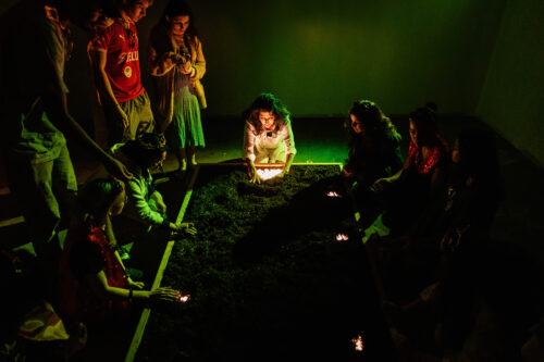 Susie K. Taylor as Avery asks the audience to join her in planting seeds of hope in Juggerknot Theatre's immersive world premiere of “Conjuring the King.”