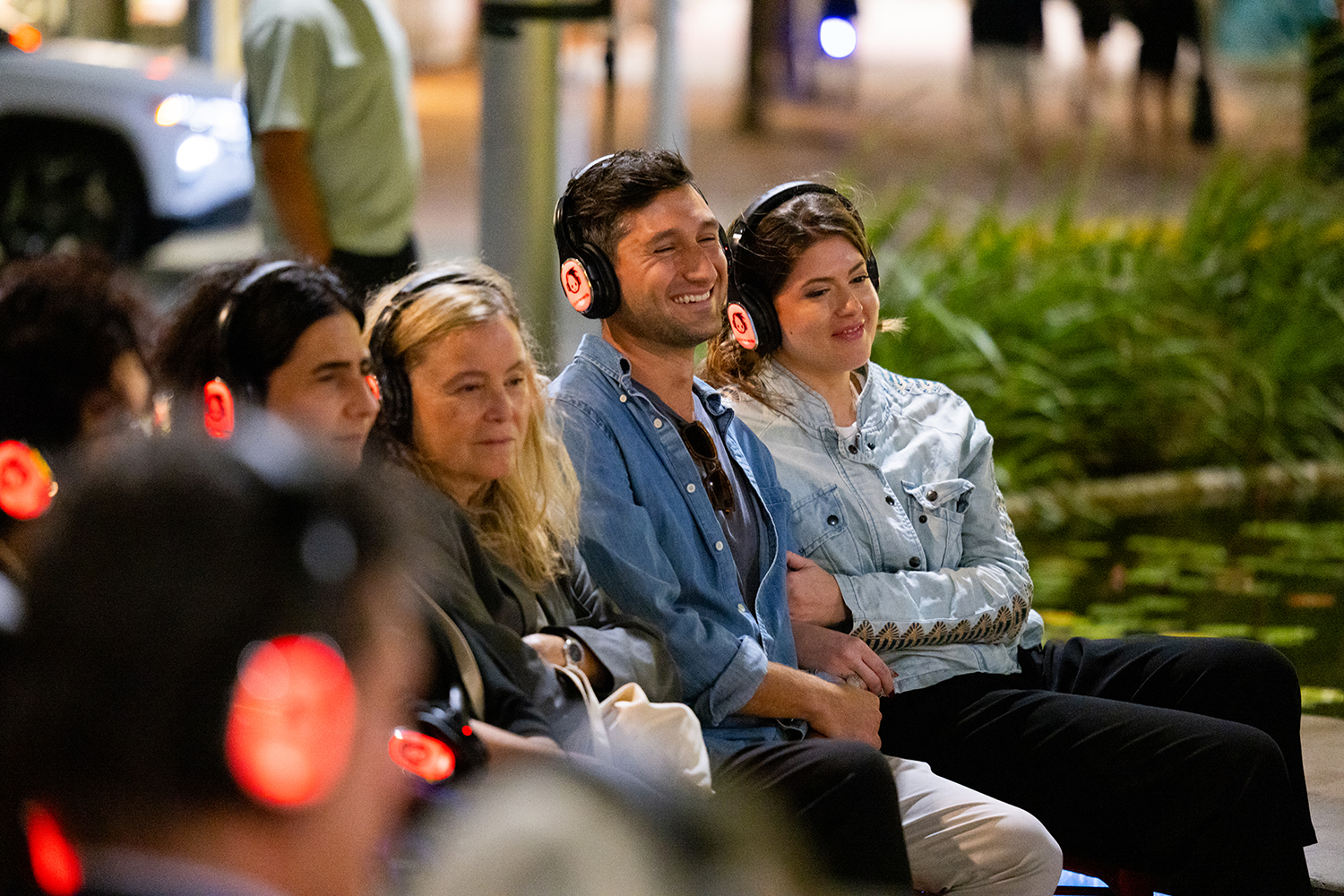The audience listens to a scene from
