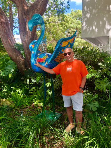 Harvey J. Burstein, publisher of miamiartzine.com and director of the Burstein Family Foundation stands with the commissioned flamingo 