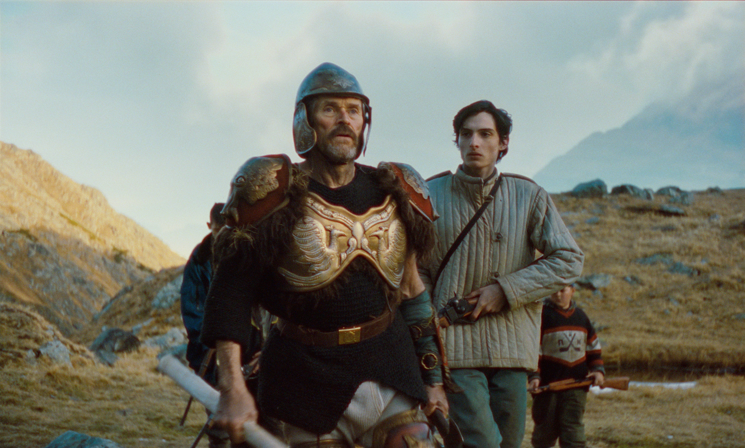 Willem Dafoe as Maxim and Finn Wolfhard as Petro in a scene from