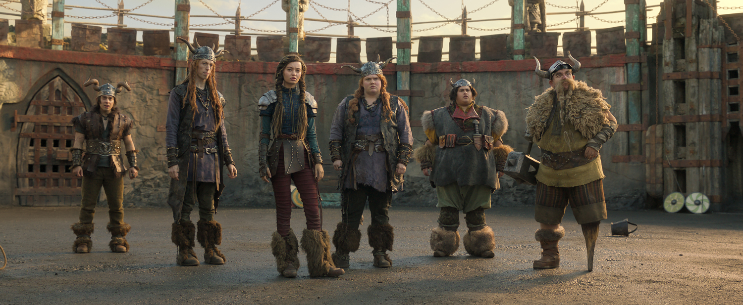 Gabriel Howell as Snotlout, Harry Trevaldwyn as Tuffnut, Nico Parker as Astrid, Bronwyn James as Ruffnut, Julian Dennison as Fishlegs and Nick Frost as Gobber in a scene from “How to Train Your Dragon.” (Photo courtesy of Universal Studios)