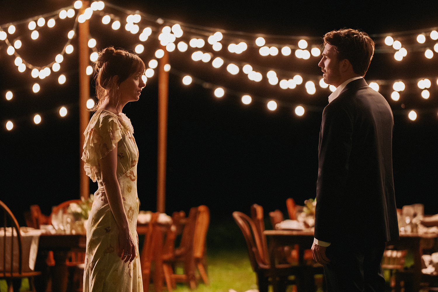 Dakota Johnson as Lucy and Chris Evans as John in a scene from