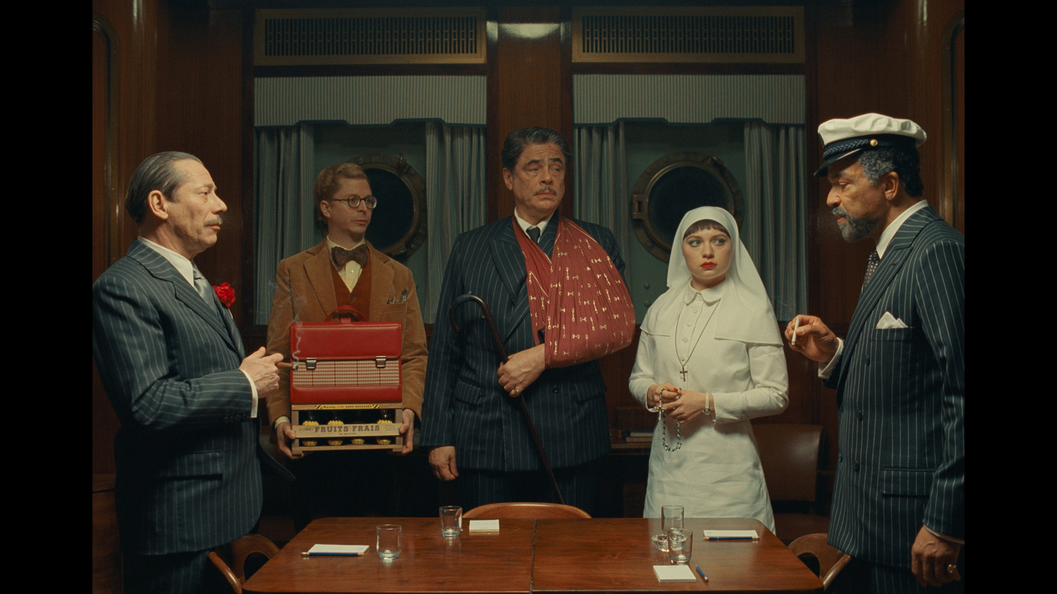 Mathieu Amalric as Marseille Bob, Michael Cera as Bjorn, Benicio Del Toro as Zsa-zsa Korda, Mia Threapleton as Liesl and Jeffrey Wright as Marty in a scene from