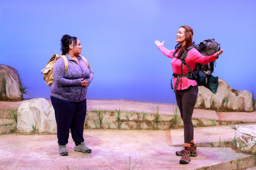 Kareema Khouri and Anna Lise Jensen play friends Paula and Monica on a hiking trip as a memorial to their friend. (Photo by Alberto Romeu, courtesy of Actors' Playhouse)