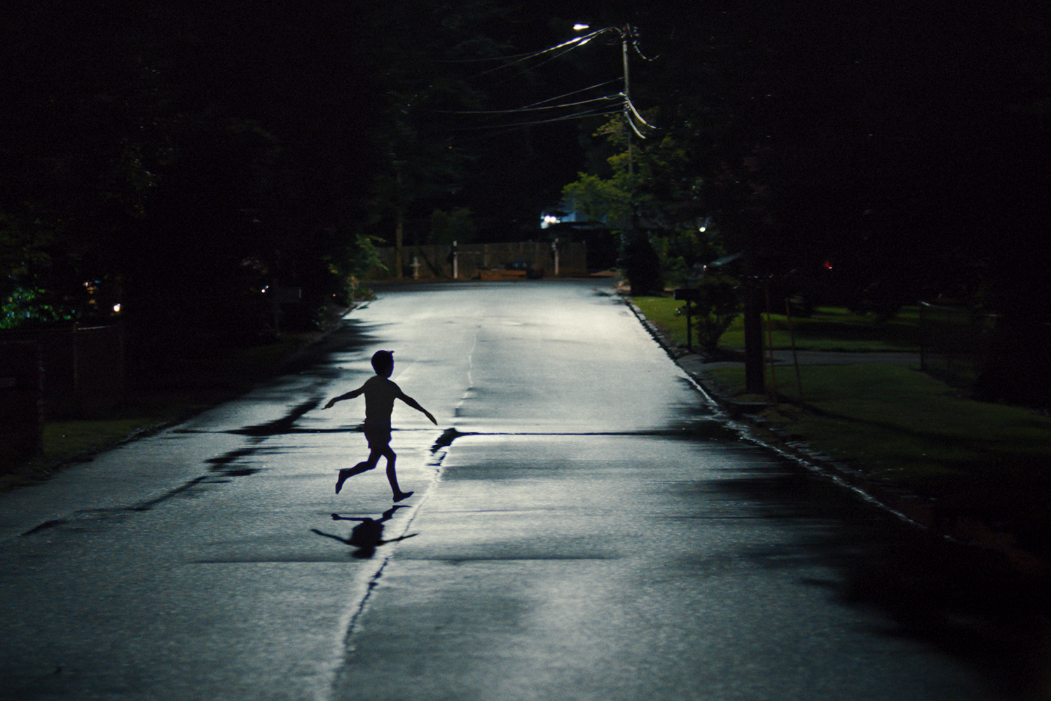 A child runs into the night in a scene from