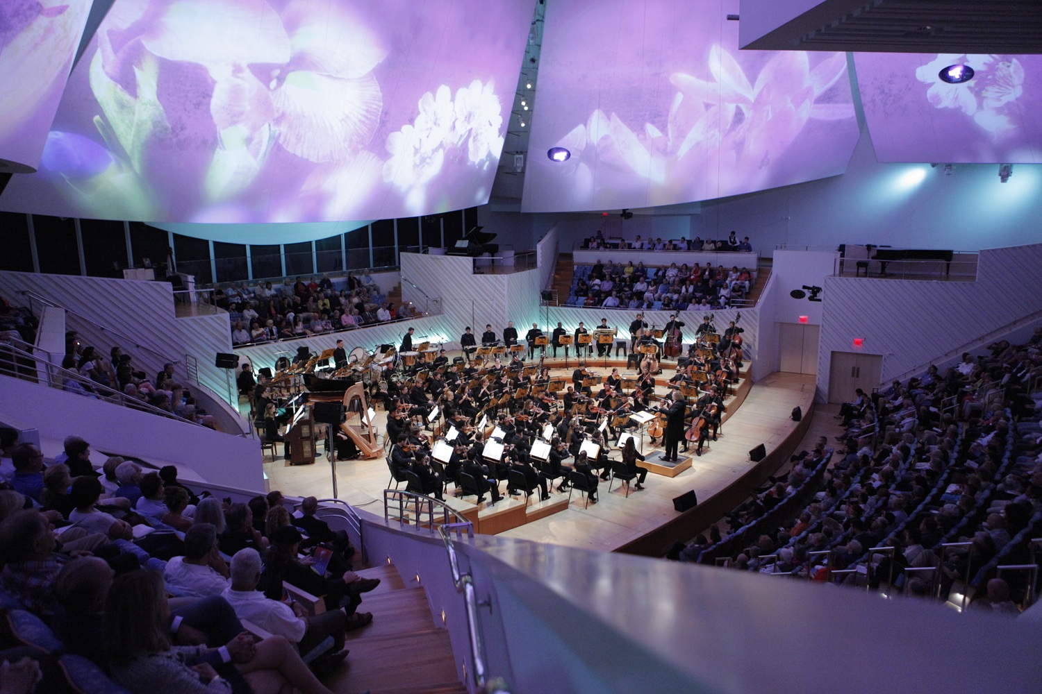 Dynamic immersive projections on the five “sails” that span the upper half of the space, will accompany two of the pieces in the opening season concert of New World Symphony.