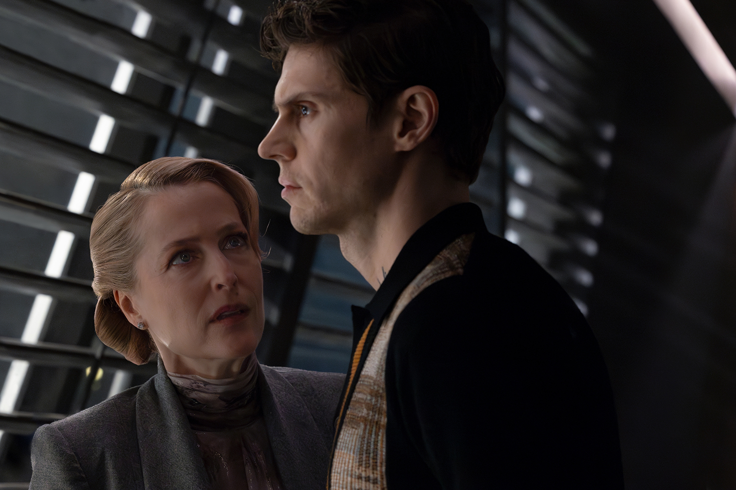 Gillian Anderson as Elisabeth Dillinger and Evan Peters as Julian Dillinger in a scene from 