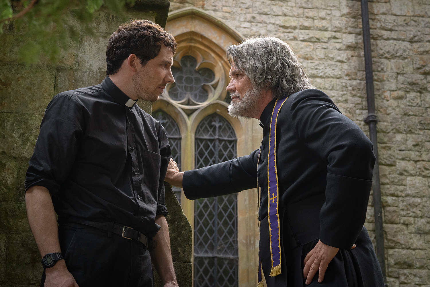 Josh O'Connor as Father Jud Deplenticy and Josh Brolin as Monsignor Jefferson Wicks in a scene from 