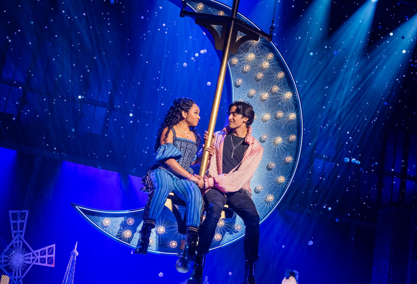 Juliet (Fabiola Caraballo Quijada) and Romeo (Joseph Torres) swing from the moon during a musical number in “Juliet” at the Broward Center for Performing Arts, playing through Sunday, Jan. 25. (Photo Credit to Evan Zimmerman)