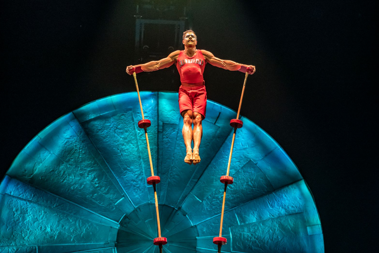 An acrobat performing on stilts during 