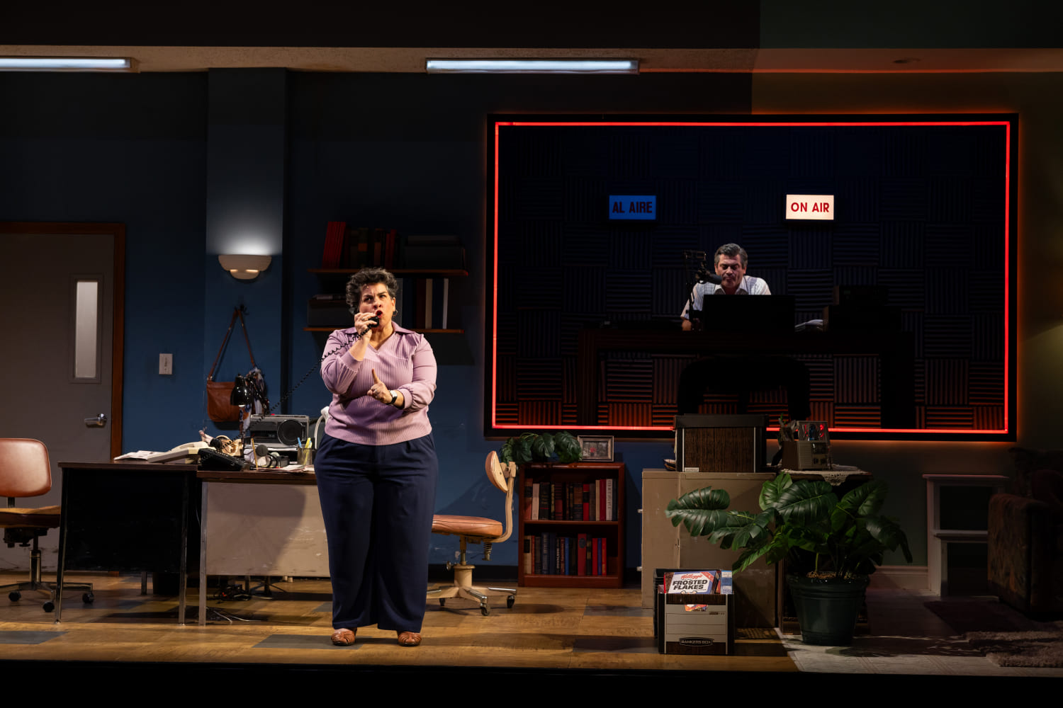 Lucy Alvarez (Carmen Pelaez) talks to radio personality Stan Rogers (Rene Granado). (Photo by Morgan Sophia Photography/courtesy of Miami New Drama)