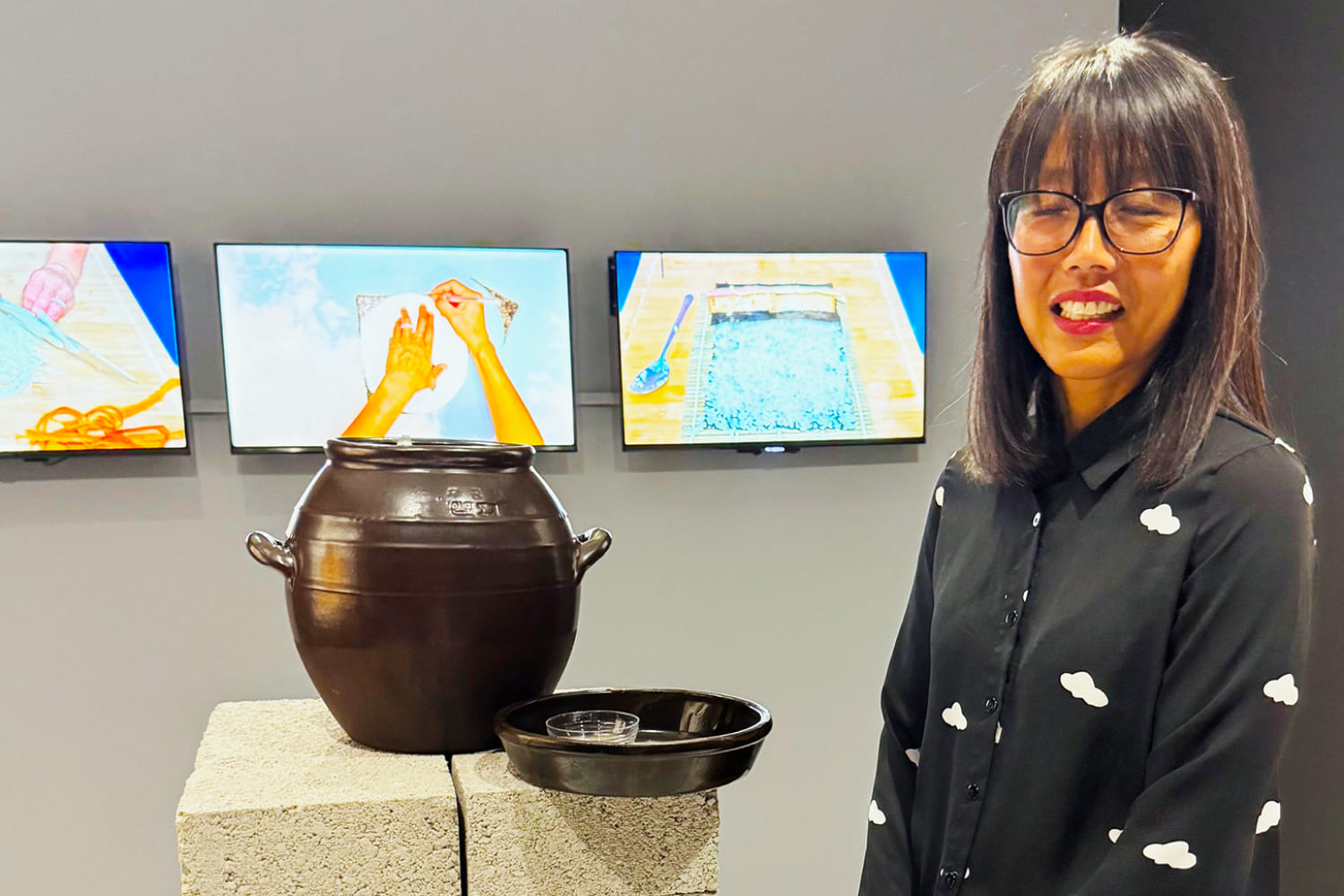 Oolite Art Center opening : Artist Susan Lee Chun serving Korean barley tea.  Photo by Irene Sperber