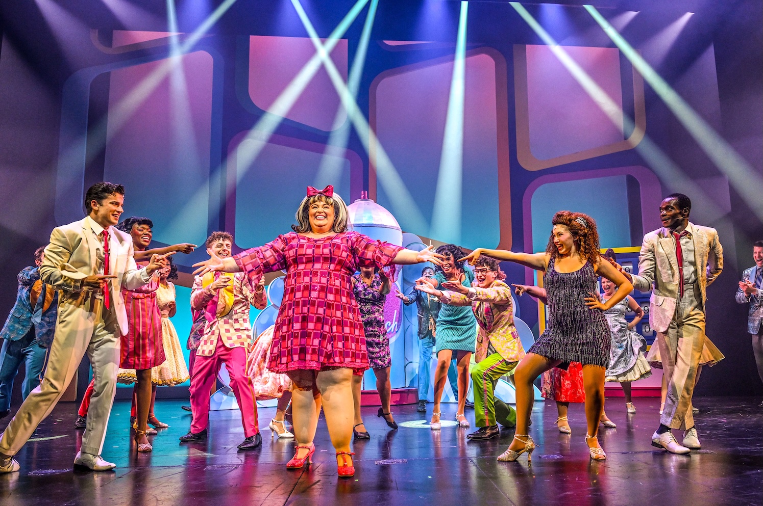 Jennifer Massey as Tracy Turnblin and company in Slow Burn Theatre's production of 