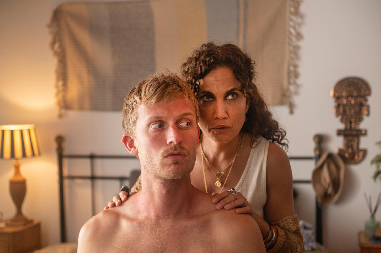 Freddie Dennis as Harry Harper and Toni Acosta as Famara in a scene from 