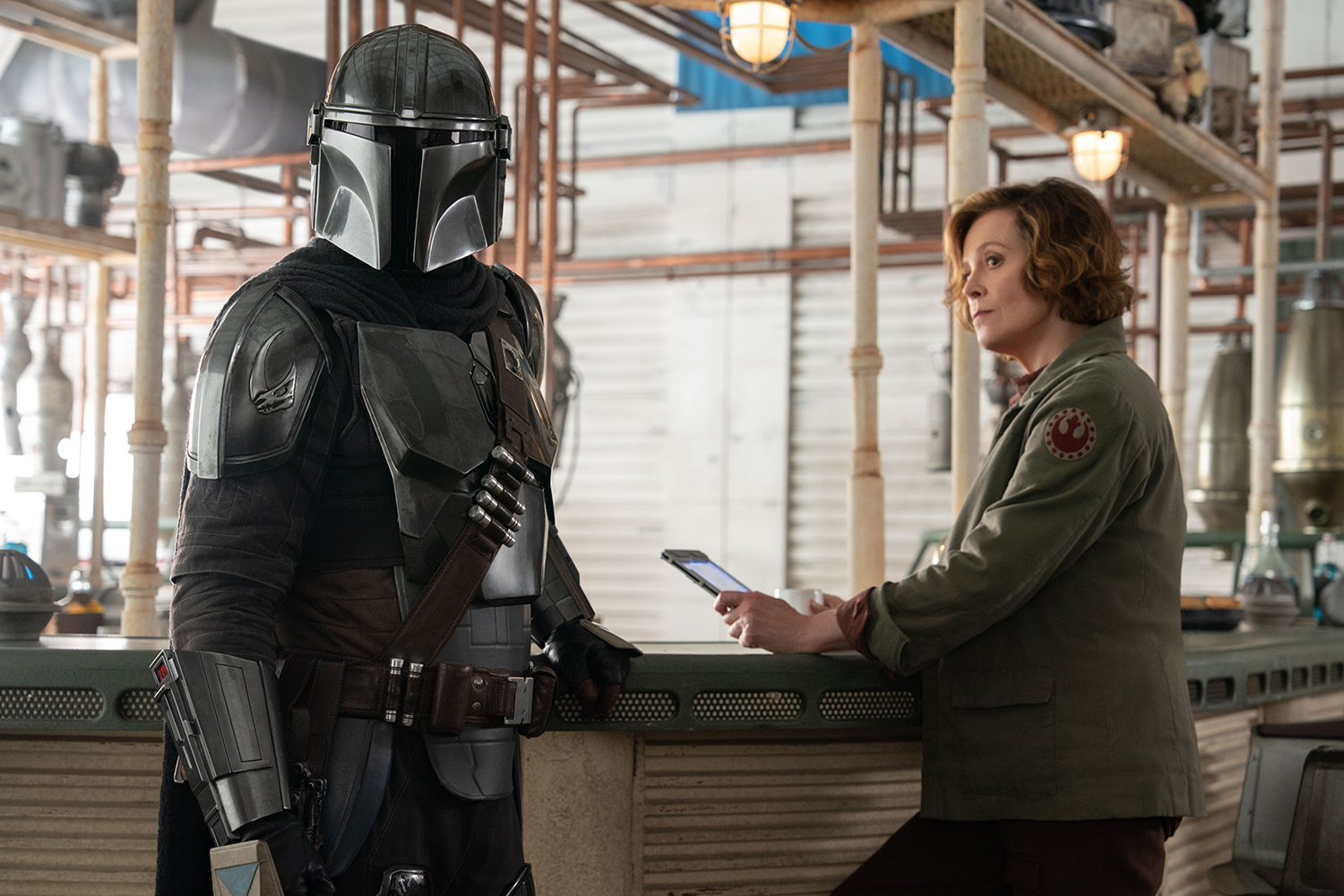Pedro Pascal as Din Djarin/The Mandalorian and Sigourney Weaver as Colonel Ward in a scene from 