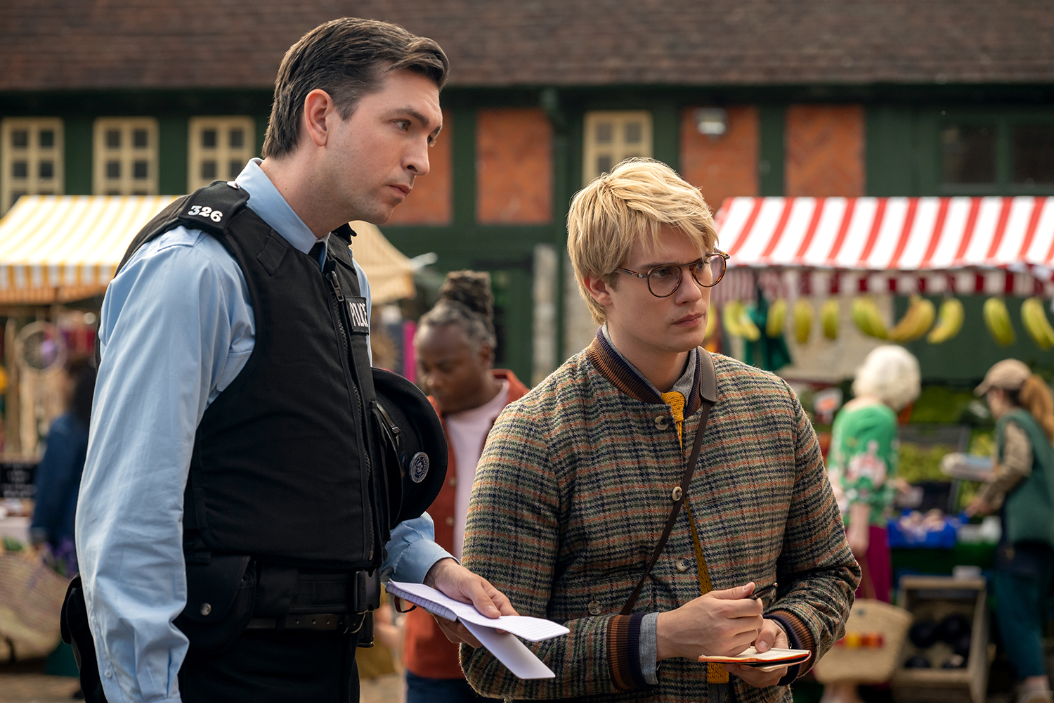 Nicholas Braun as Officer Tim Derry and Nicholas Galitzine as Elliot Matthews in a scene from 