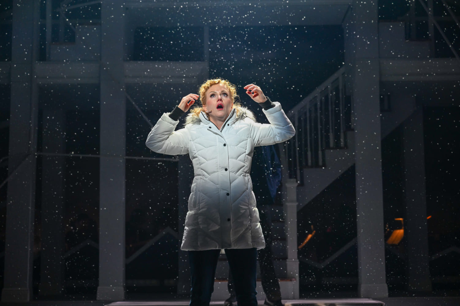 Snow falls as a troubled Mary Jane Healy (Kimberly Doreen Burns) observes. (Photo by Larry Marano)