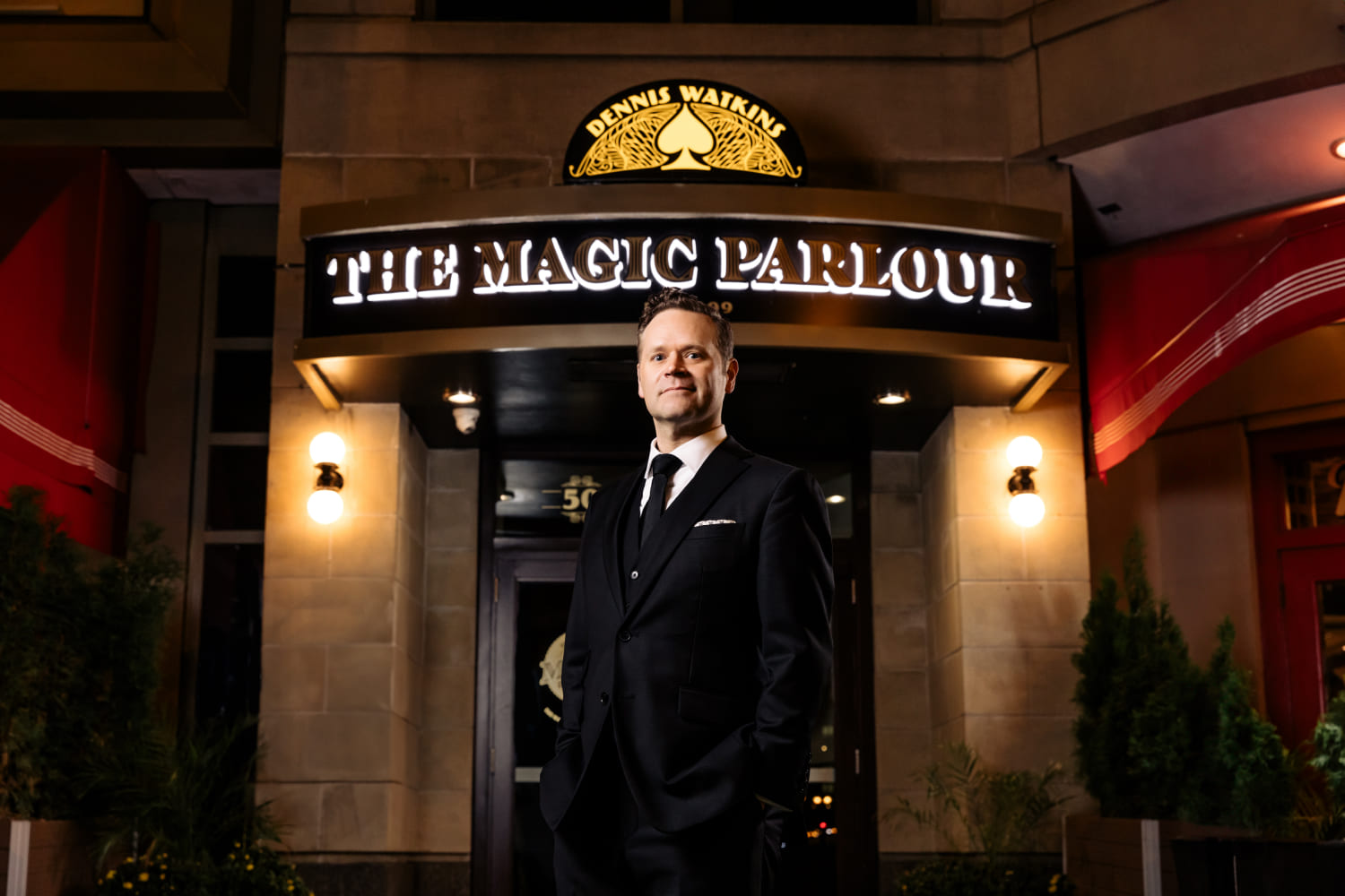 Magician Dennis Watkins outside the marquee at his current “Magic Parlour” in Chicago.