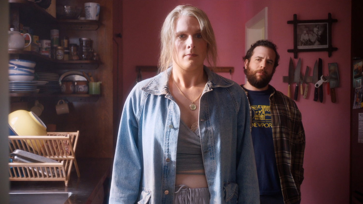 John Early as Maddie Ralph and Eric Rahill as Jake in a scene from 